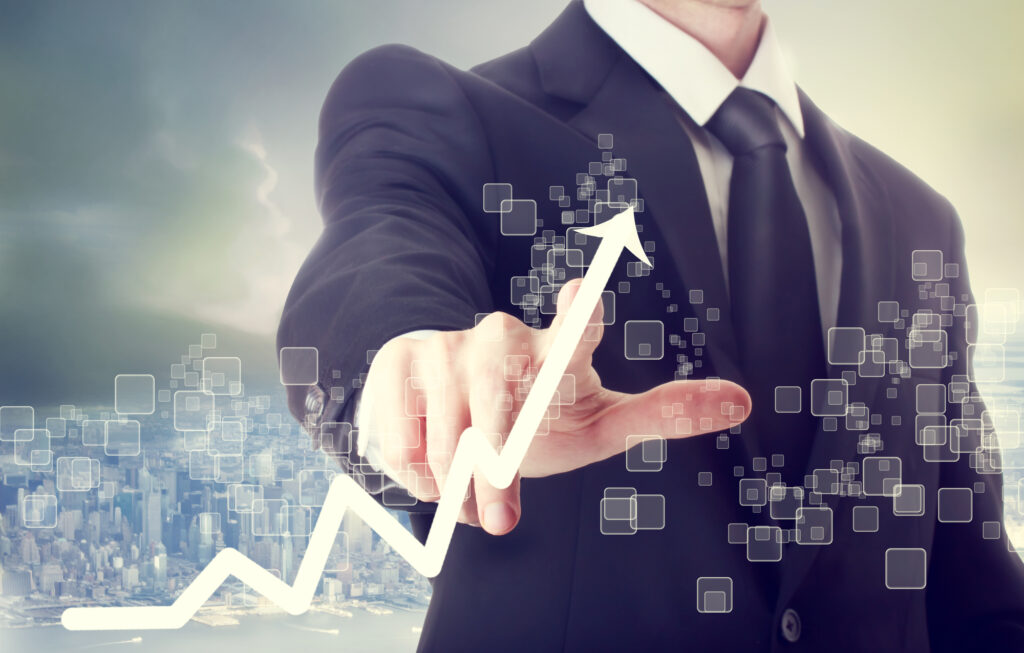 business man touching graph indicating growth